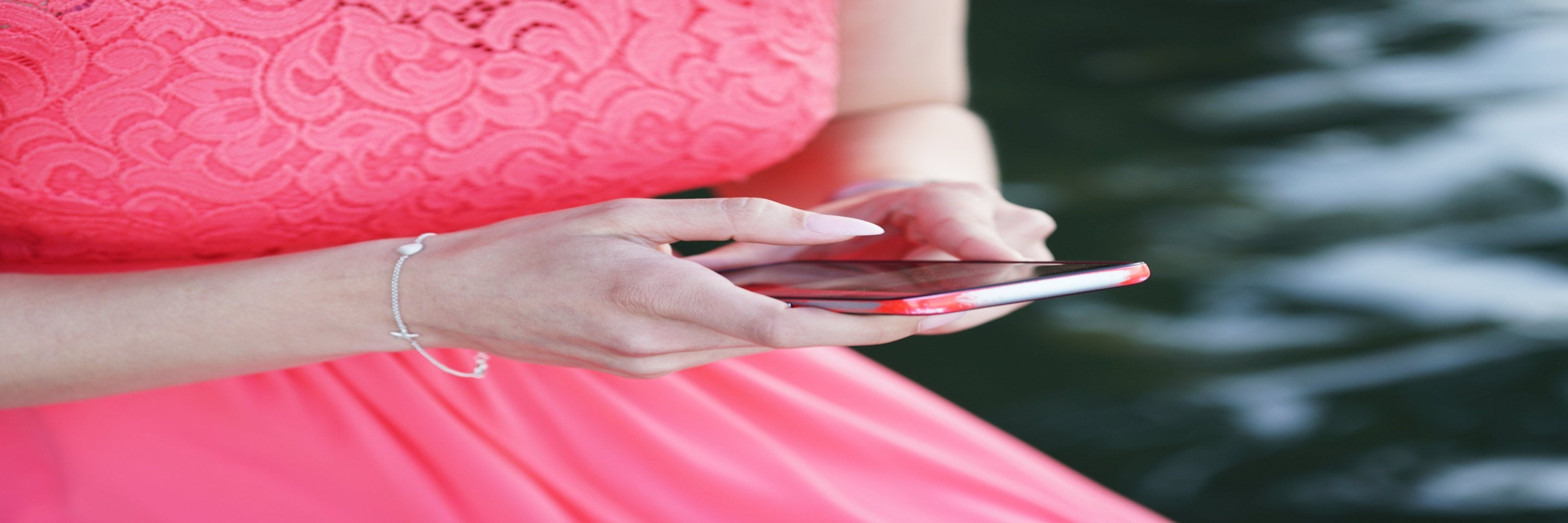 woman-wearing-dress-holding-smartphone.jpg